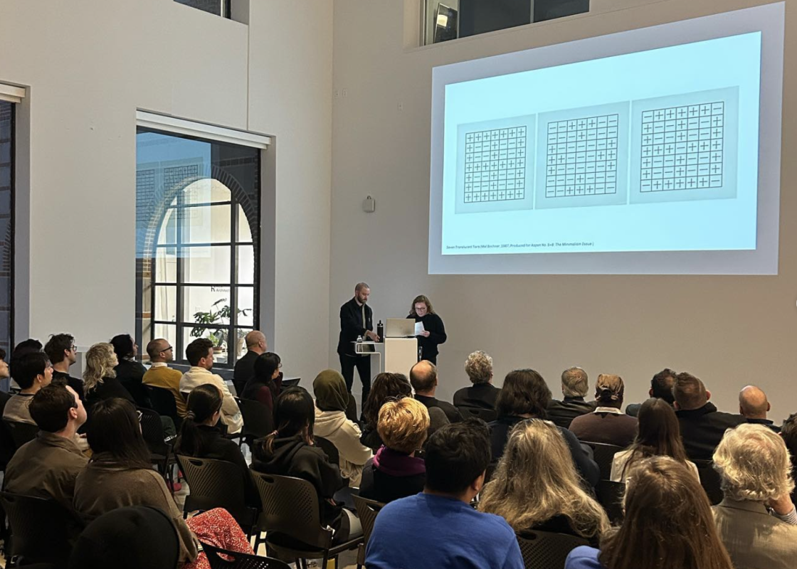 HDRG 2022 Winners Lecture Two people lecturing to a crowd